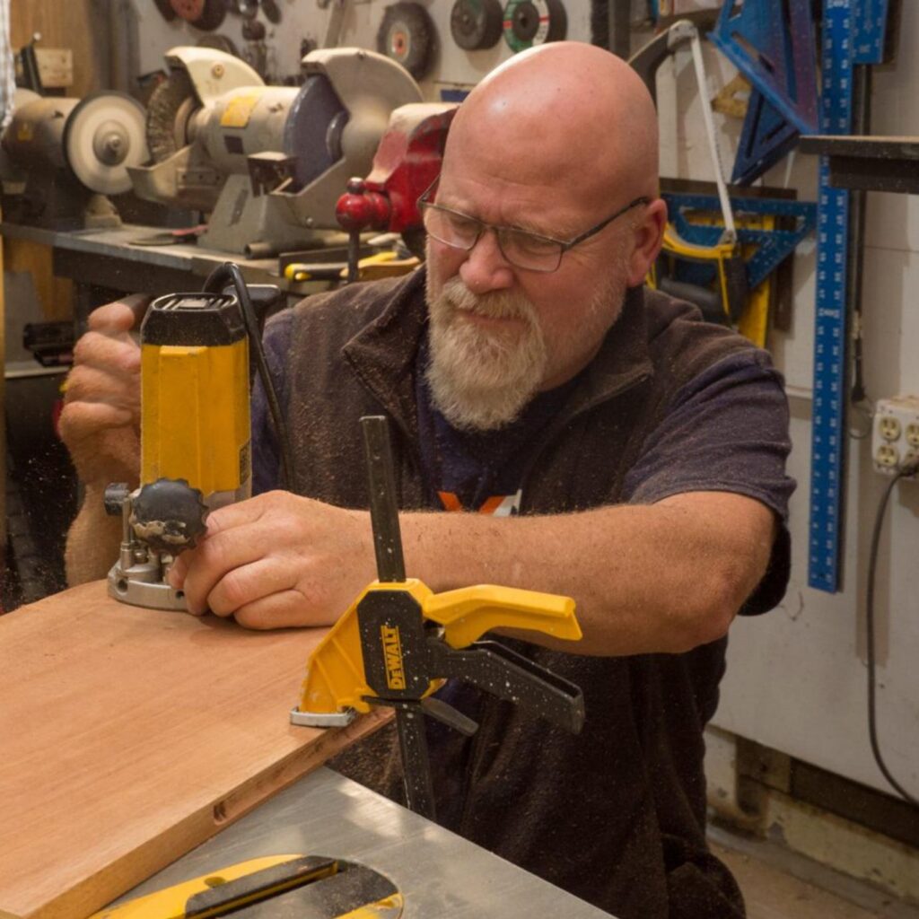 Portrait of John Van Huystee, Board Advisor and restoration instructor for the USS Lucid project.