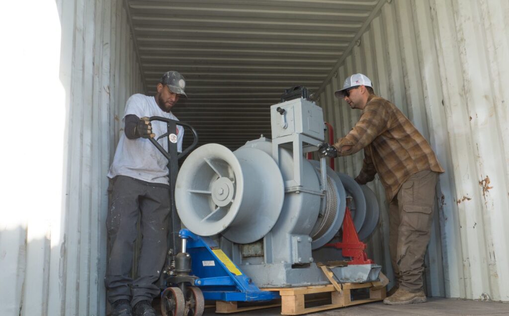 Volunteers of USS Lucid delivering parts